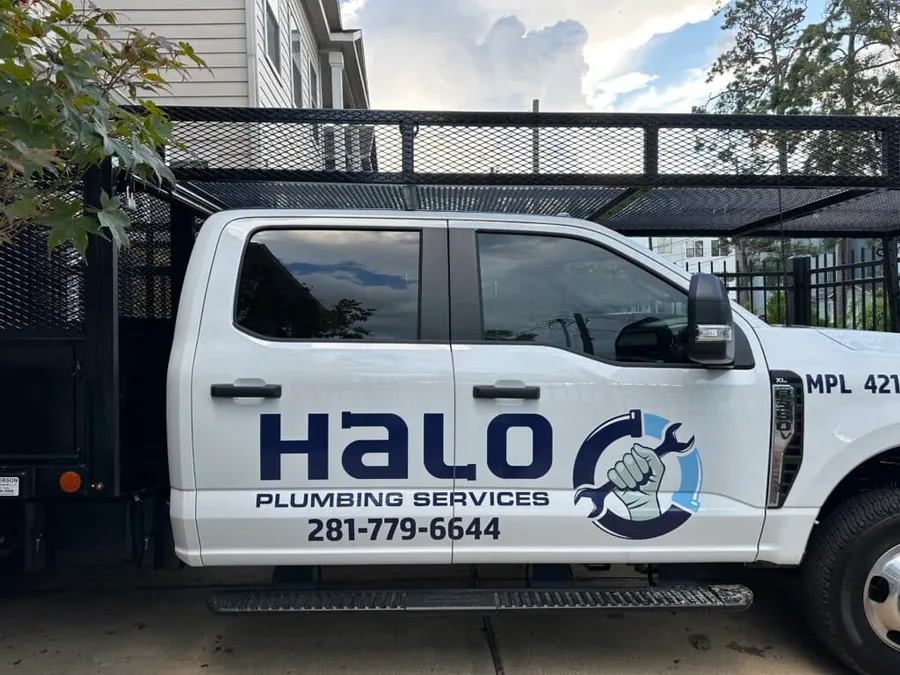 Halo Plumbing branded service truck on a Houston street